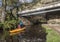 Canoeist with class at canal bridge at Uppermill