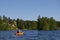 Canoeist on lake