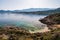 Canoeist in small cove at Revellata in Corsica