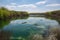 canoeists and kayakers paddling through serene waters on a picturesque day