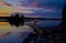 Canoer carries a canoe, at sunset, mn