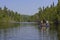 Canoers Heading into a North Woods lake