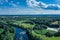 Canoes on the calm river. Top view. Beautiful picture of river and green banks of the river in the summer morning day