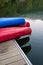 Canoes on a dock next to a lake