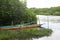 Canoes docked on the riverbank next to the mange. Fishing boats