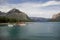 Canoes, kayaks, boat cruise lake Minnewanka. Mountain tourism, Banff National Park, Alberta, Canada