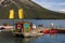 Canoes, kayaks, boat cruise lake Minnewanka. Mountain tourism, Banff National Park, Alberta, Canada