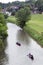 Canoes and kayaks floating down the Galena River in Galena Illinois