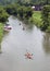 Canoes and kayaks floating down the Galena River in Galena Illinois