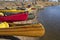 Canoes and kayaks lined up on a beach before springtime paddling trip on the South Platte River