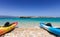 Canoes lying on a pebble beach in the Cyclades