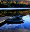 Canoes moored on a country pond