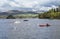 Canoists and motor boat on Lake Windermere in the Lake District