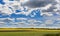 Canola landscape rapeseed field and blue sky.