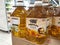 Canola oil and sunflower oil in packs for sale in commercial plastic bottles.