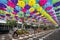 Canopy of multicolored umbrellas suspended over CityPlace Doral boulevard.