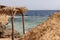 Canopy of palm leaves on the shore of the Red Sea, Egypt