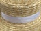 Canotier hat. Straw hat on wooden background