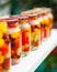 Cans with cherry tomatoes home canning on the table