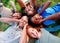 We cant contain the joy. High angle view of a group of kids lying down and covering their ears while they laugh at the