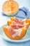 Cantaloupe melon with prosciutto. italian appetizer