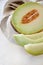 Cantaloupe melone on light textured background