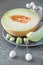 Cantaloupe melone sliced on grey plate