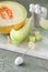 Cantaloupe melone sliced on marmor board