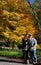 Canton, GA-circa November 2019:  Couple takes a selfie in front of a golden yellow Acer Japanese Maple as a backdrop