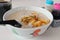 Cantonese Ting Zai porridge or congee, with a cup of traditional Nanyang black coffee, a breakfast comfort food in SE Asia