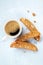 Cantucci. Traditional Italian almond biscuits with a cup of coffee