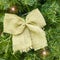 Canvas bow and led garland on fir tree. Christmas and new year background for greeteng card