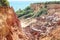 Canyon of cliffs with many stones sedimented by time, rocks with red and yellow colors and the sea in the background.