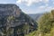 Canyon Gorges de la Nesque, gray cliffs with green forest in summer sunny day in Provence, South France