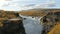 Canyon of Hvita river and view on picturesque waterfalls flowing through lava fields, Hraunfossar