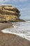 Canyon on Namibe Desert Beach. with sea waves. Angola. Africa. Namibe