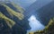 Canyon seen from above with a ship sailing leaving a wake in its wake