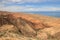 The canyon Skazka (Fairy Tale) and Issyk Kul lake on the background, Kyrgyzstan