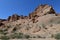 Canyon sunlit view with rocks and a pronounced texture of a yellowish stone