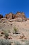 Canyon sunlit view with rocks and a pronounced texture of a yellowish stone, portrait orientation