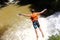 Canyoning male jumping into canyon Vietnam