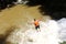 Canyoning male jumping into canyon Vietnam