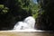 Canyoning male jumping into canyon Vietnam