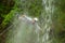 Canyoning Tour Leader Jumping Into A Waterfall
