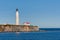 Cap des rosiers lighthouse during a cloudless day