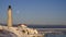 Cap-des-Rosiers lighthouse with full moon in the background.