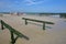 CAP GRIS NEZ, FRANCE - AUGUST 27, 2017: Mussels cultivated on poles bouchots on the beach near Cap Gris Nez with horse riding in