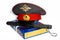 The cap of a Russian police officer and a rubber baton is on the code of laws. Isolate.