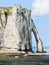 Cape with arch on beach of Etretat