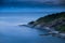 The cape of beach at night, sea still and light from fishing boat